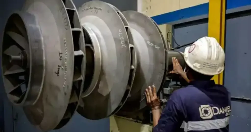 Technician performing dynamic balancing on large industrial equipment to ensure precision, stability, and reliable performance.