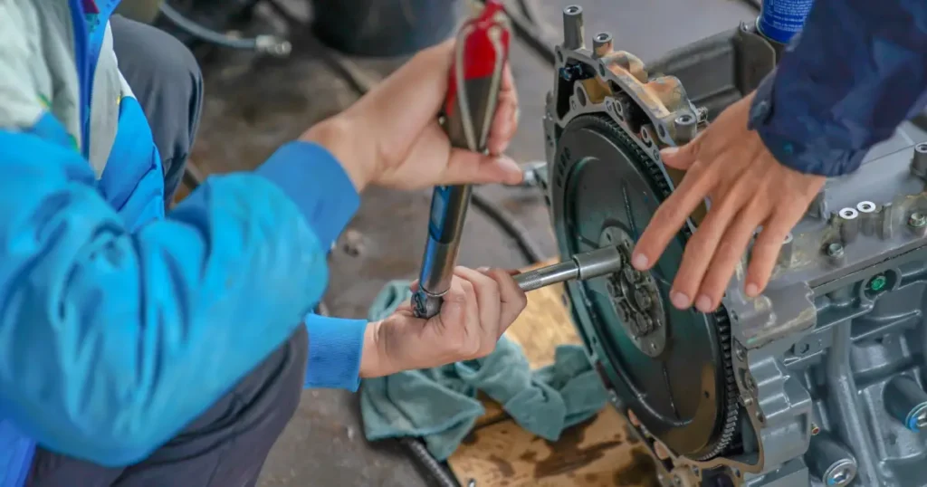 Technicians carrying out motor preventive maintenance by inspecting and servicing mechanical components for reliability and efficiency.