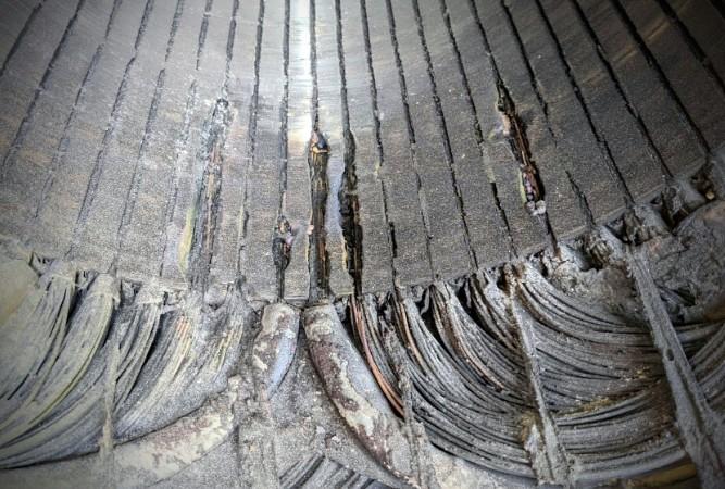 Damaged electric motor stator core with burnt laminations and deteriorated winding insulation
