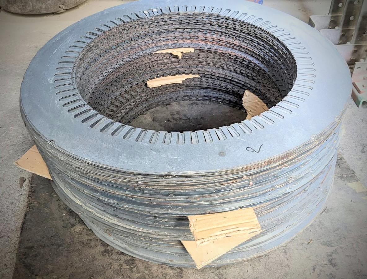 Stack of electric motor stator core laminations prepared for restacking during core repair