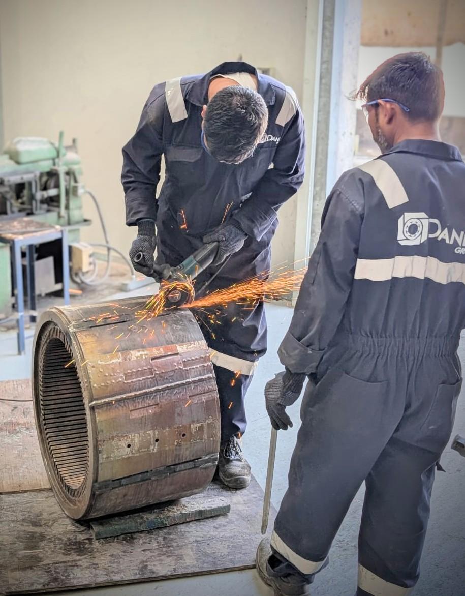 Daniel Group technicians carrying out electric motor stator core repair in the workshop